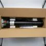 Cylindrical 92mm tubular shutter motor with drive crown and adaptor ring at one end and the power cable exiting the limit switch head