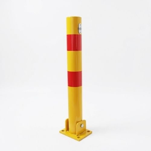 Carbon steel manual parking lock post standing 600 mm tall on a square base plate in a concrete parking bay, with its key lock at the top